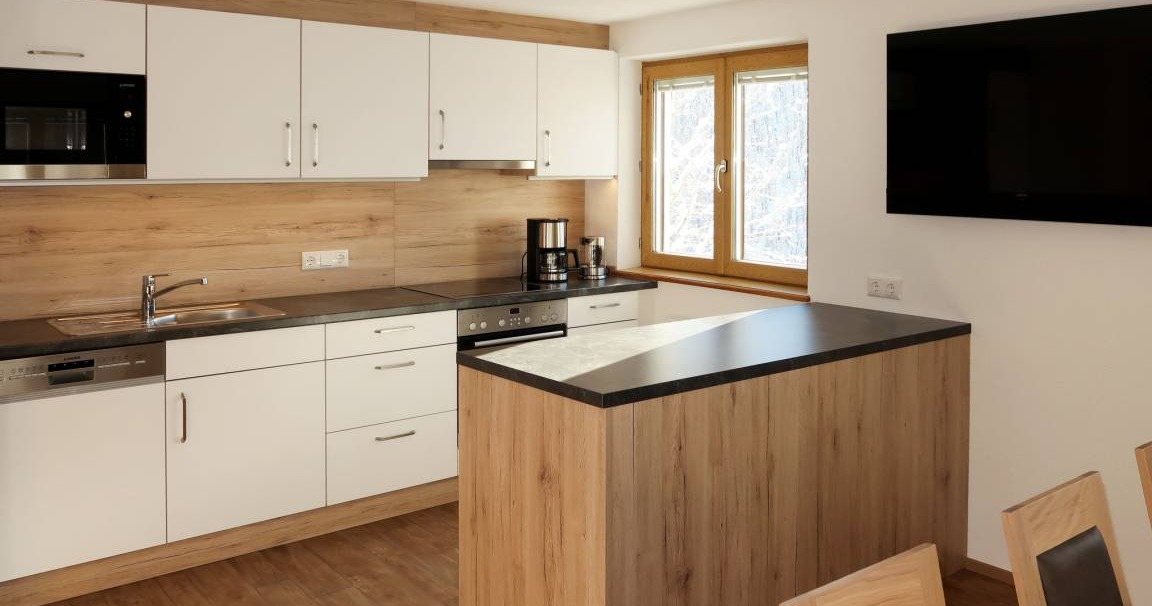 New kitchen with island at Holiday Home Schönblick